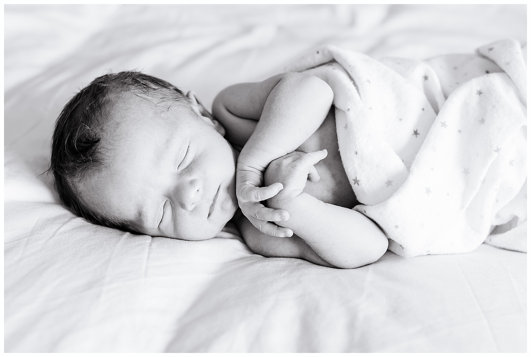 newborn baby sleeping black and white 