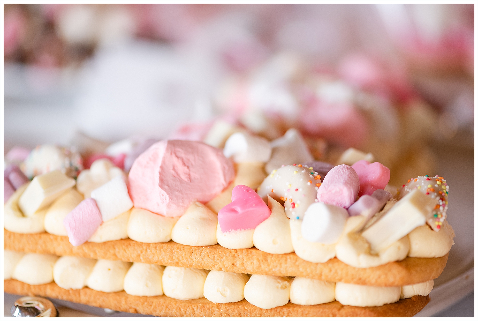 biscuit cake with meringue topping in pink shades