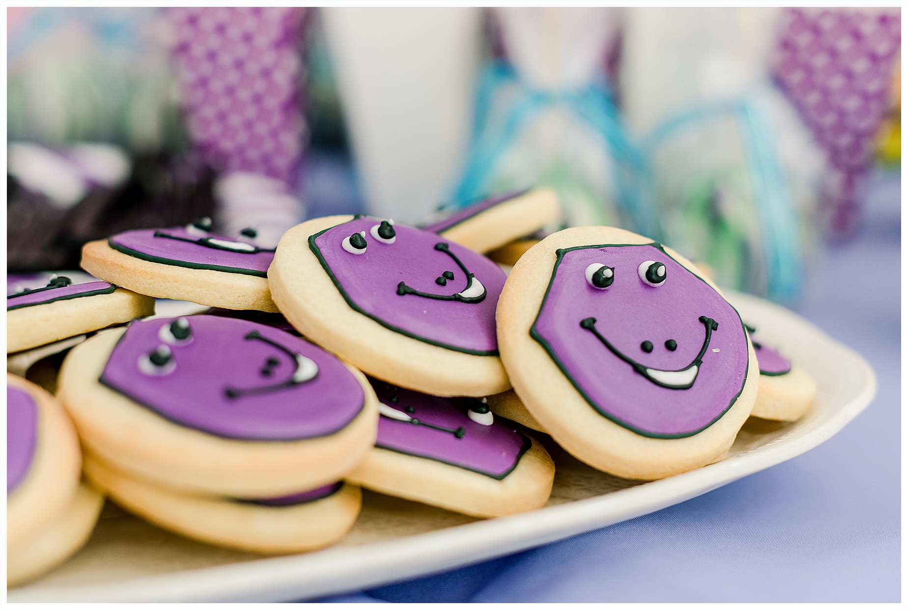 Purple and green Barney themed iced biscuits