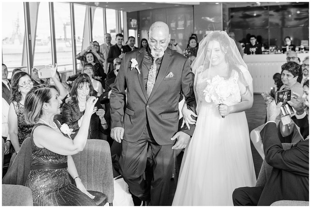 Bride and dad walking up the aisle