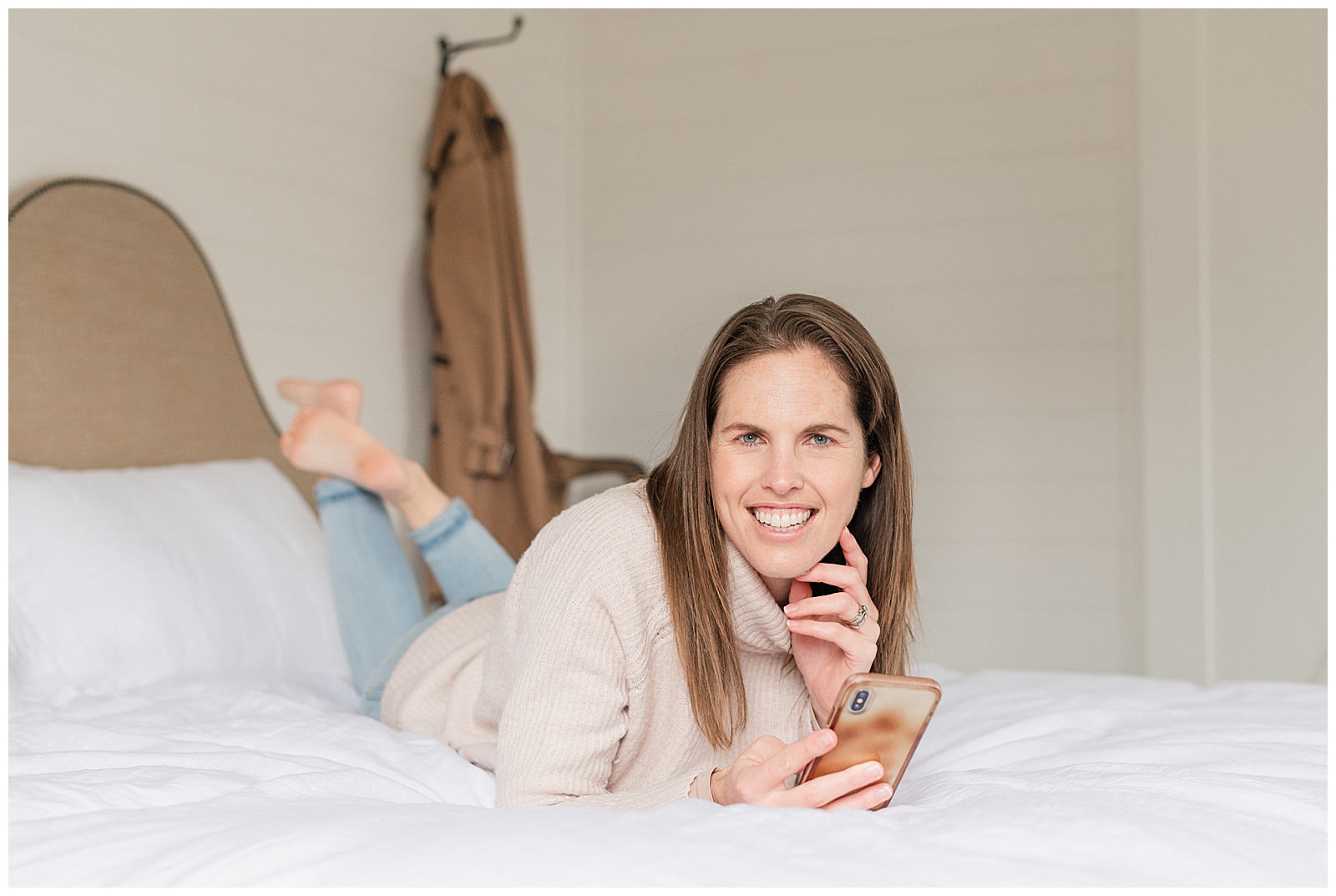 Relaxed lifestyle business headshot checking phone